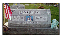 Picture of Iowa cemetery headstone designed and manufactured by the Iowa Memorial Granite Company for the Moseley family. The slant face raised headstone is located in St. Mary's Cemetery in Muscatine, Iowa.