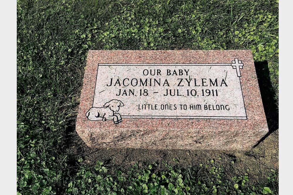 Bevel marker for child with lamb and cross